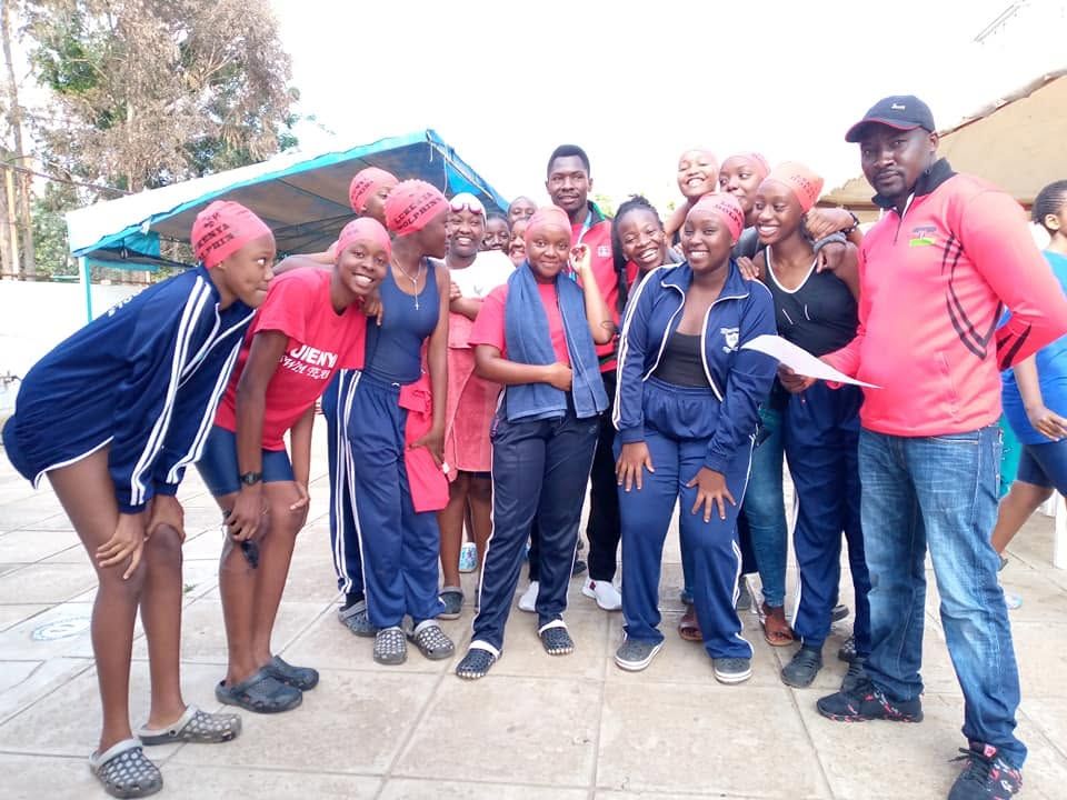 The swimming team celebrating